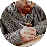 Man with beard wearing a sweater writing about his Adirondack region search engine optimization strategry